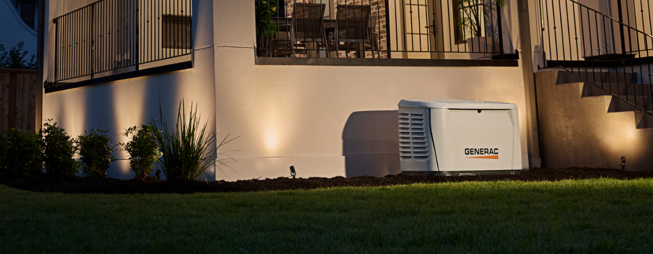 Generac home standby generator powering a home in the dark